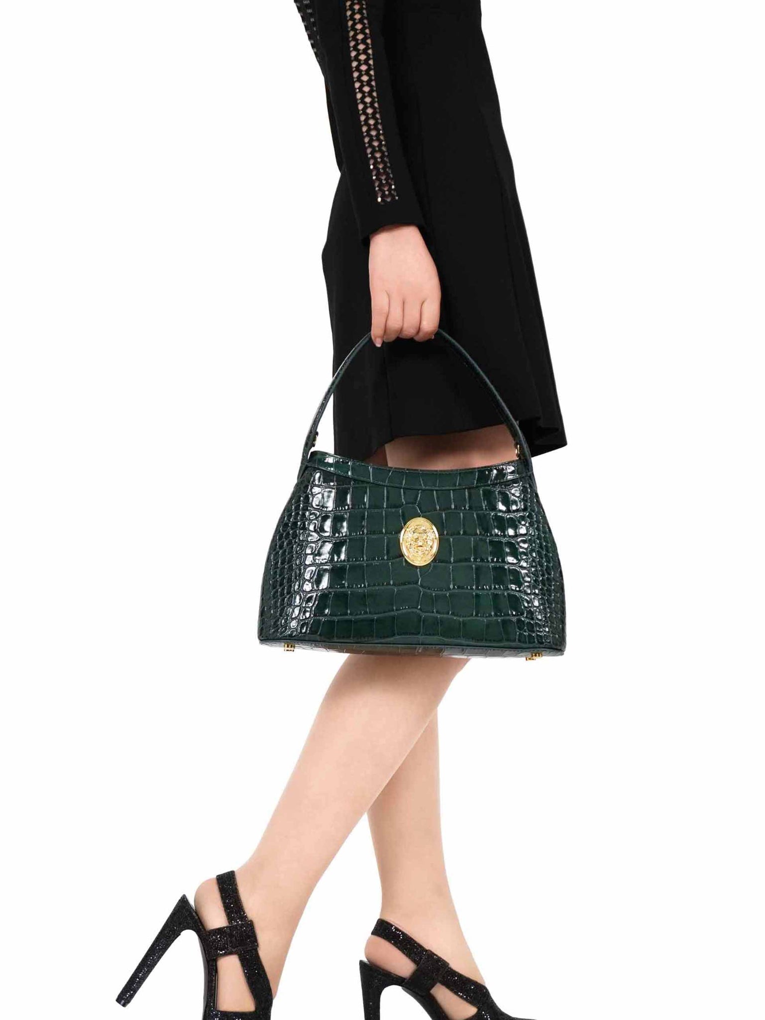 Gamberini Bag. Premium Italian calfskin leather. 18K gold-plated oval accessory. Hand-sewn embroidery.