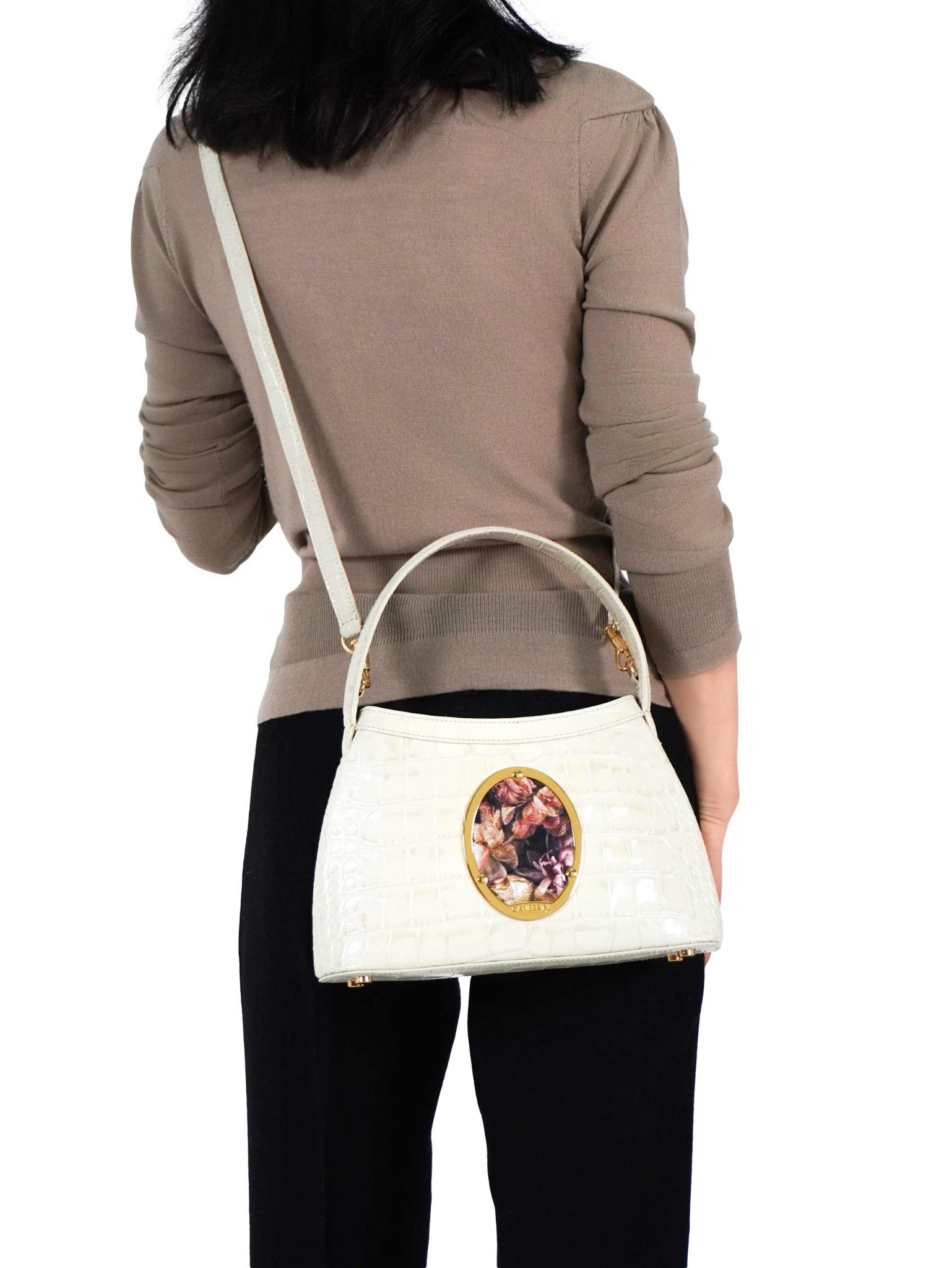 Gamberini Bag. Premium Italian calfskin leather. 18K gold-plated oval accessory. Hand-sewn embroidery.