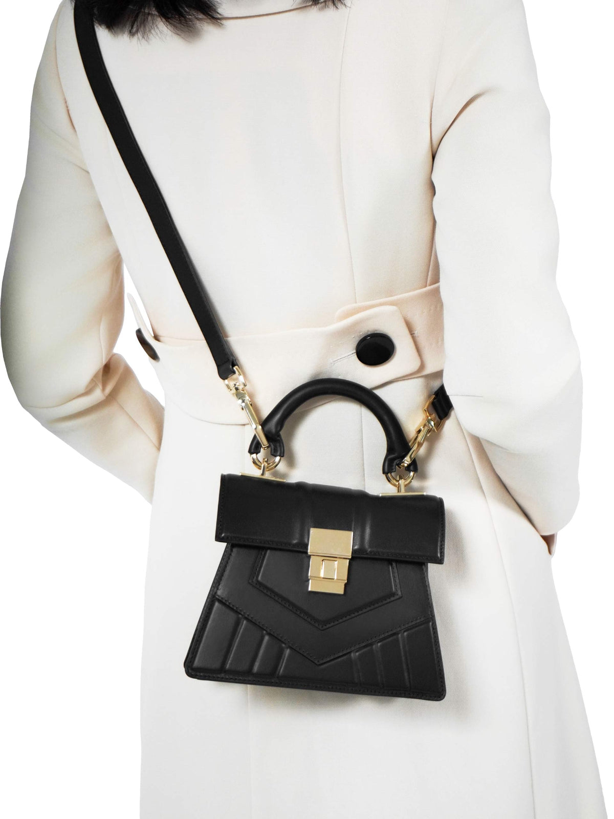 Futuristic Kelly Bag – Geometric quilted Italian made leather handbag with 18k gold-plated hardware, round tubular handle, and adjustable shoulder strap.