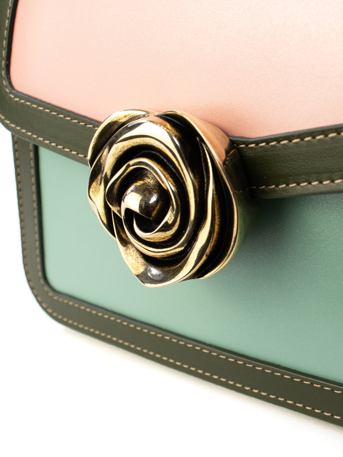 Candy Bag – French-deisnged, Italian made luxury handbag with smooth calf leather, rose-shaped clasp, and sleek design, crafted in Italy with premium materials.