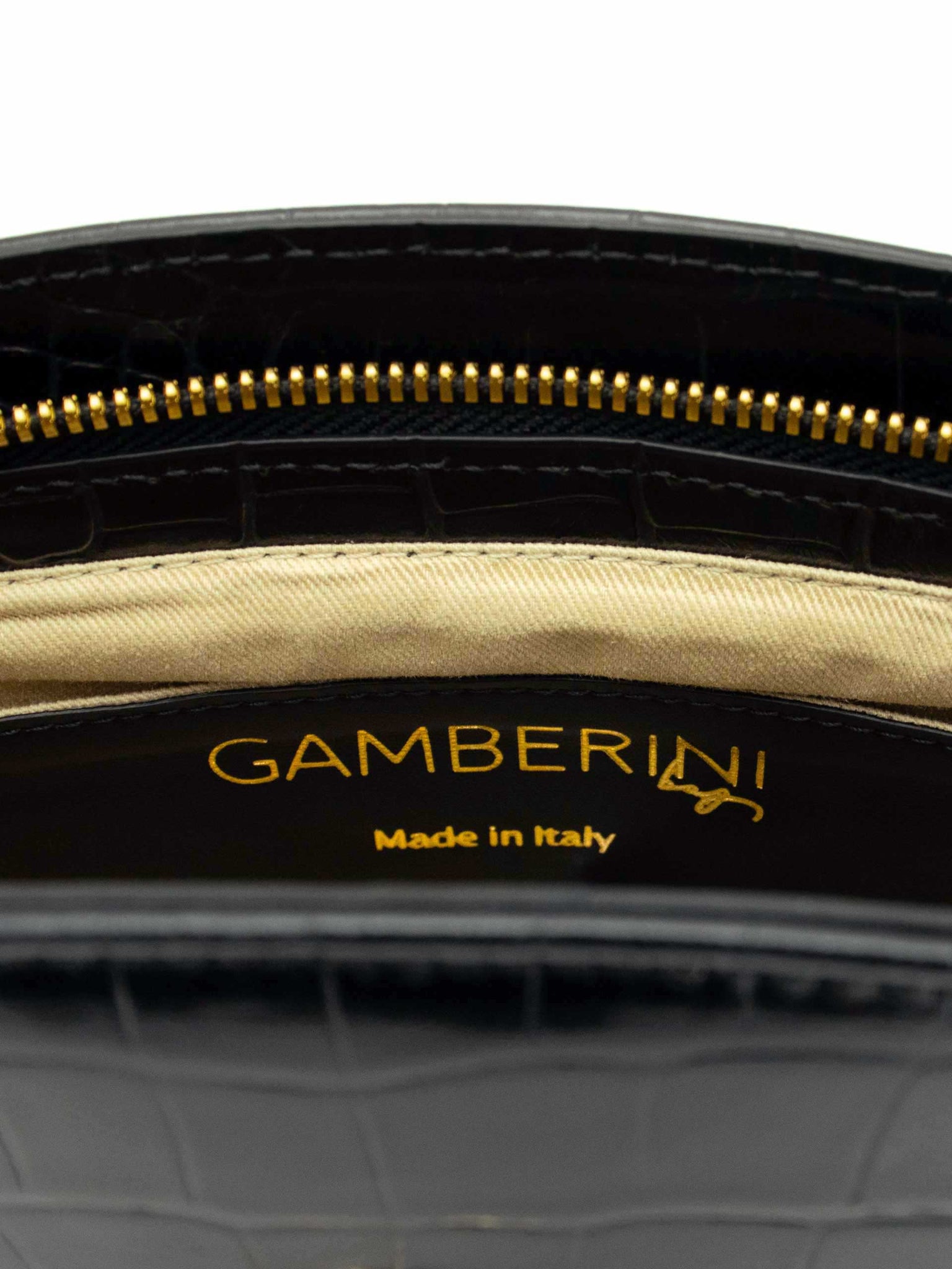 Gamberini Bag. Premium Italian calfskin leather. 18K gold-plated oval accessory.   Timeless Italian elegance.