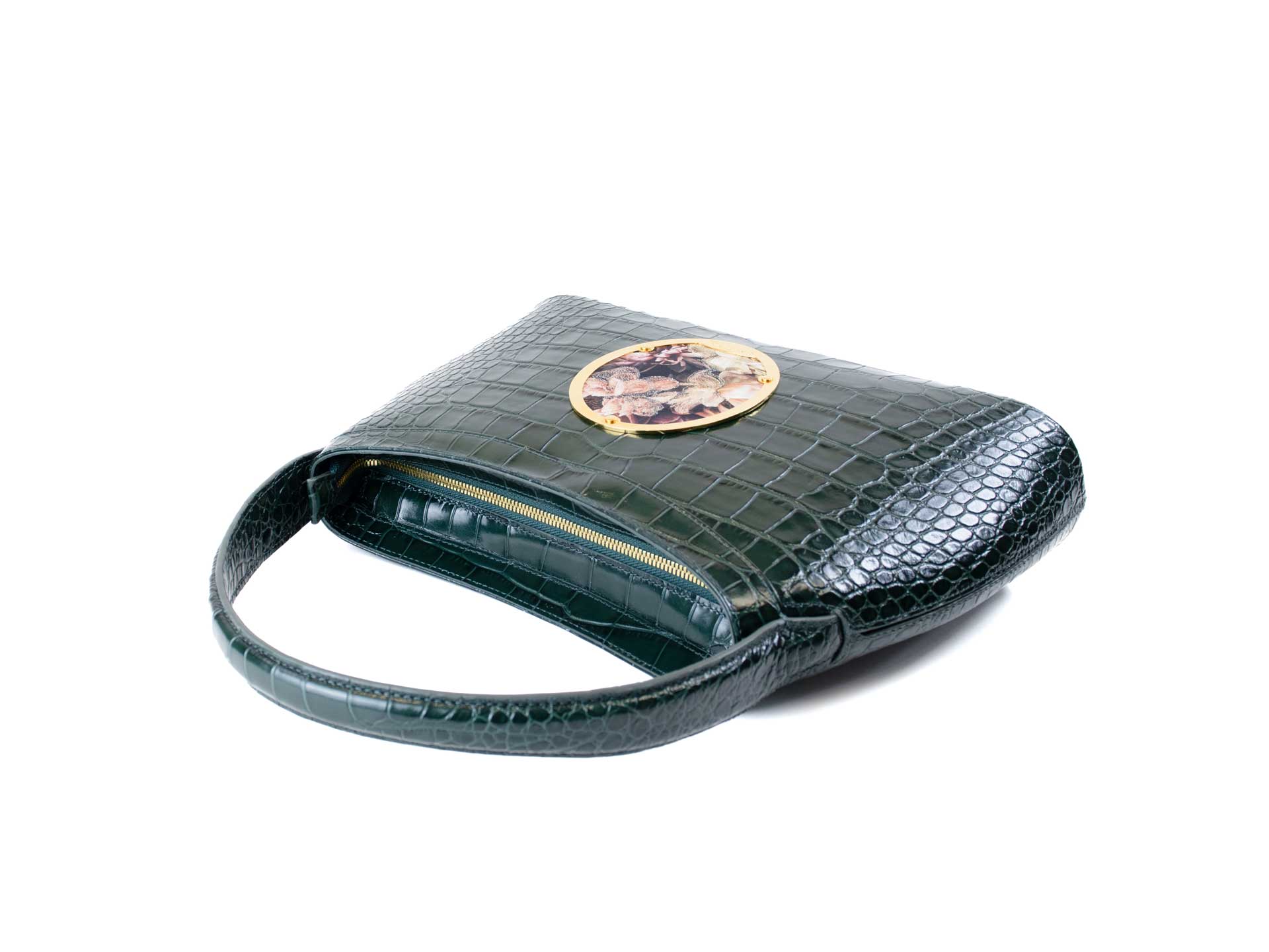 Gamberini Bag. Forest green. Premium Italian calfskin leather. 18K gold-plated oval accessory. Hand-sewn embroidery. 
