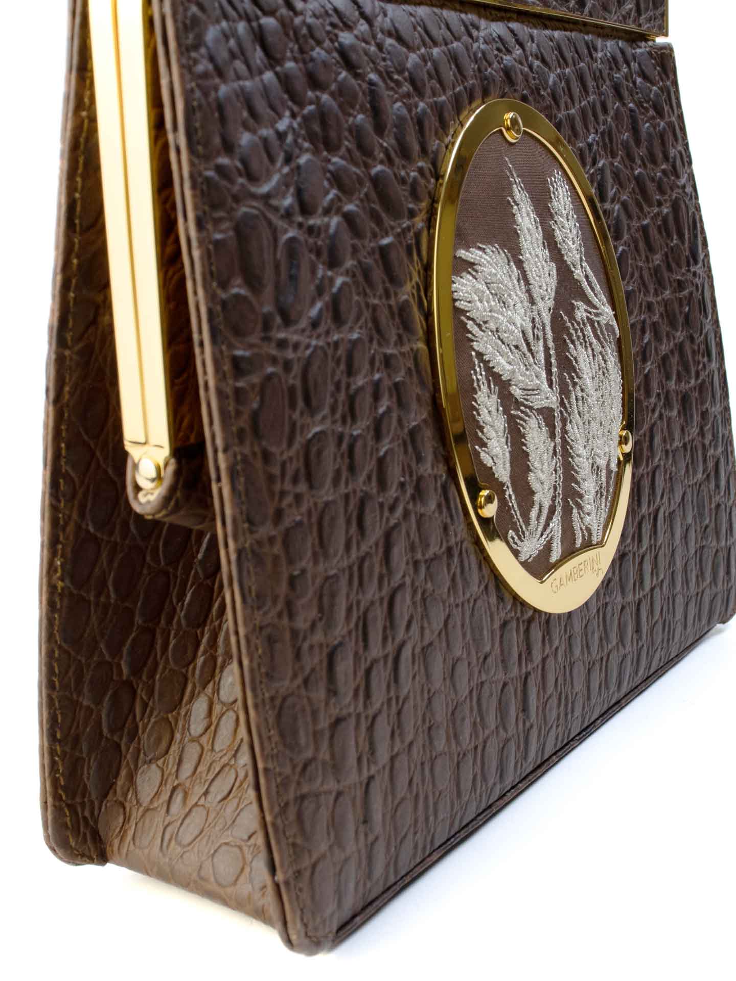 Maria Bag – Luxury Italian Handbag with Timeless Elegance. Traditional Italian craftsmanship with modern aesthetics.  18K gold-plated oval frame, adorned with hand embroidered golden wheat.