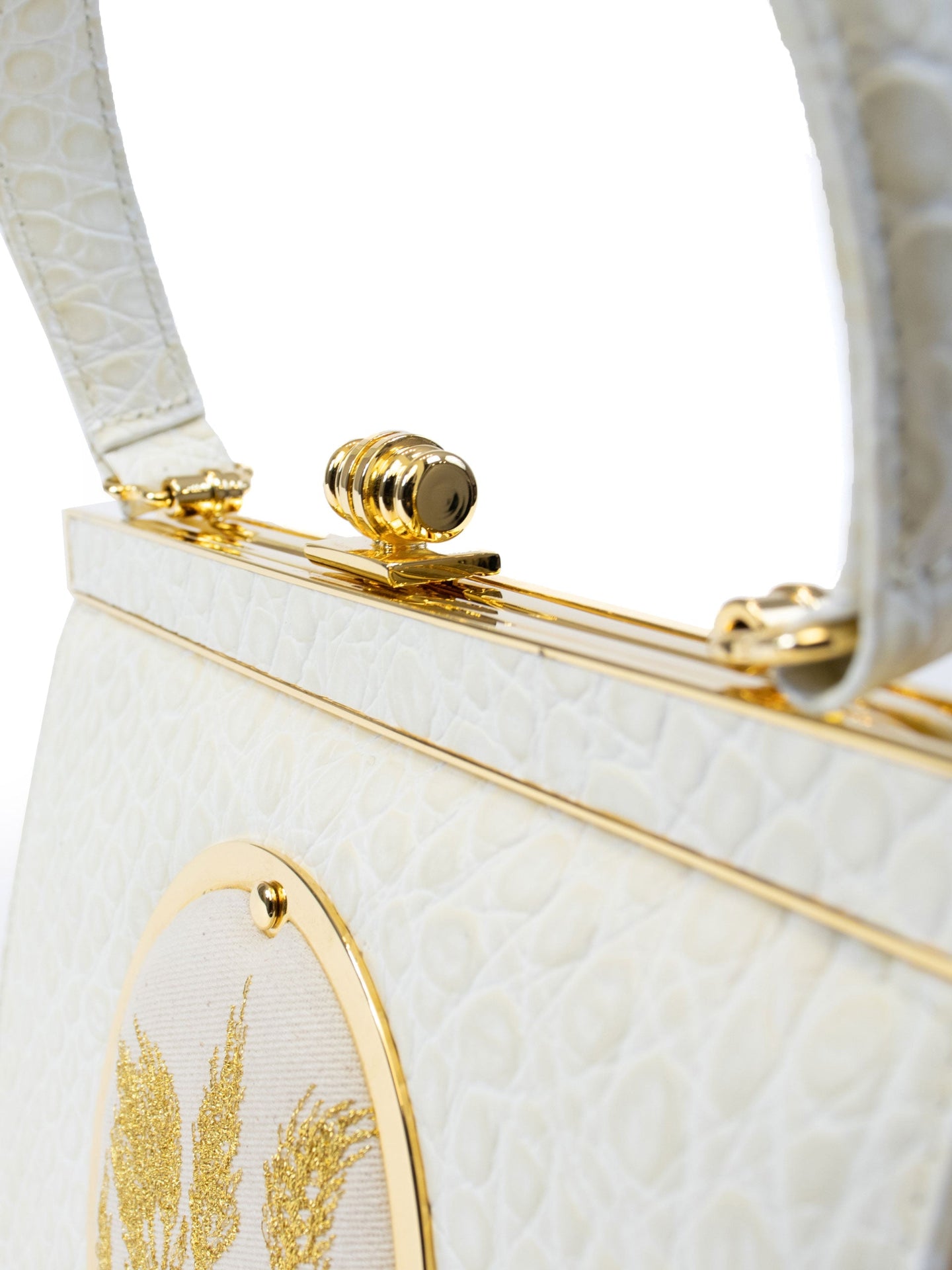 Maria Bag – Luxury Italian Handbag with Timeless Elegance. Traditional Italian craftsmanship with modern aesthetics.  18K gold-plated oval frame, adorned with hand embroidered golden wheat.