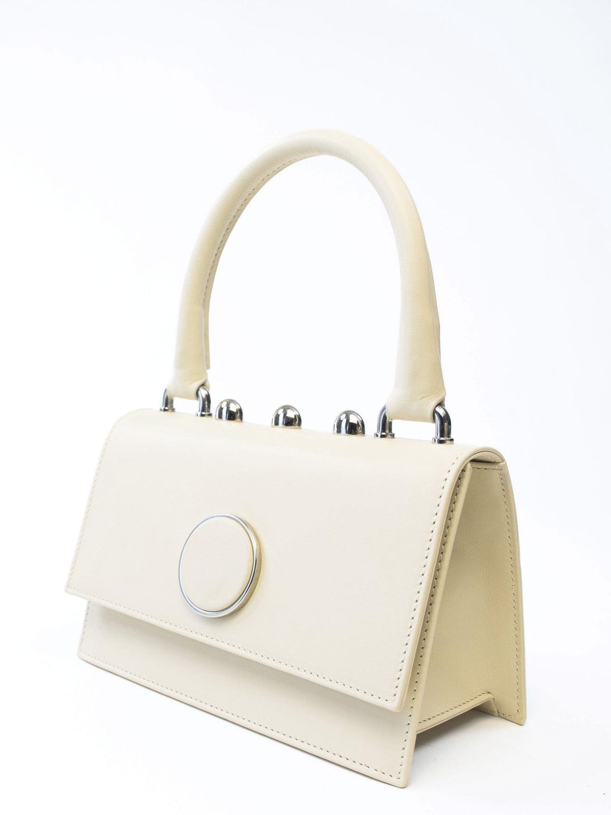 Ambra Bag – Italian crafted handbag with detachable shoulder strap, flap closure, silver-toned accessories, and three rounded studs.