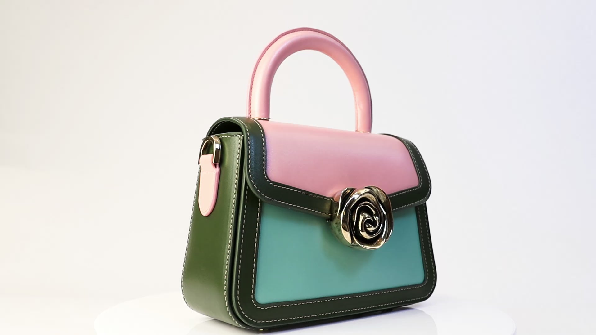 Candy Bag – French-deisnged, Italian made luxury handbag with smooth calf leather, rose-shaped clasp, and sleek design, crafted in Italy with premium materials.